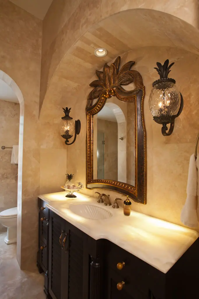 A bathroom with a big mirror and lights